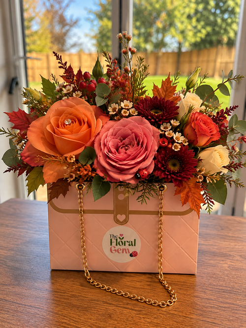 Miniature Handbag Arrangement with autumnal seasonal blooms